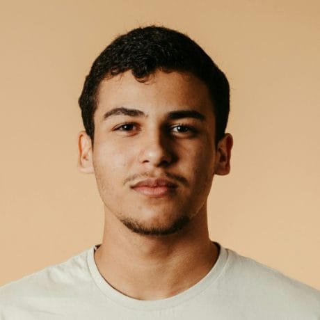 Man wearing a tshirt smiling - Image by JSB Co