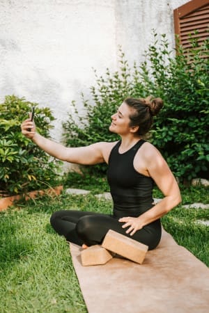 Woman taking a selfie celebrating a small win - Image by Elisabeth Jurenka