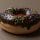 Chocolate donut with sprinkles - Image by Valeria Istrate